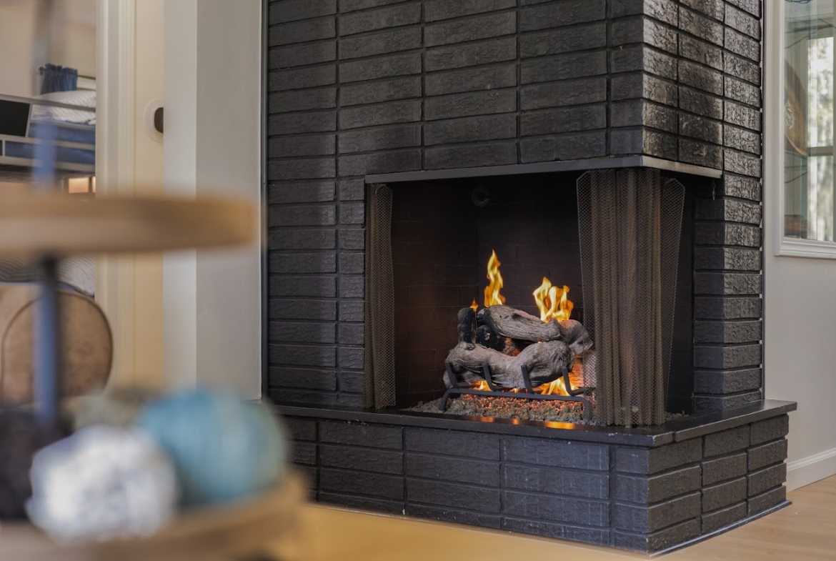 Cozy fireplace in a Holland, MI home highlighting warmth and comfort during winter showings.