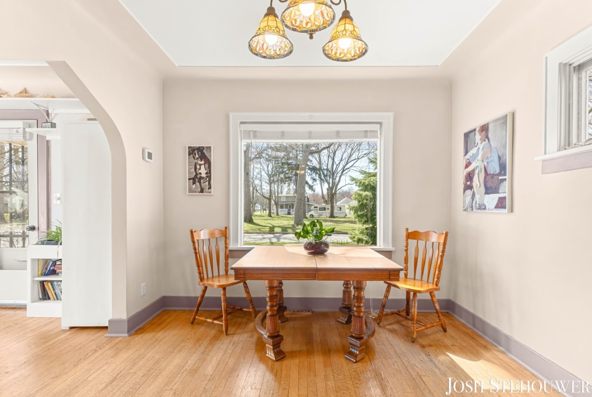 Dining room with large window and natural light inside a Holland, MI home.