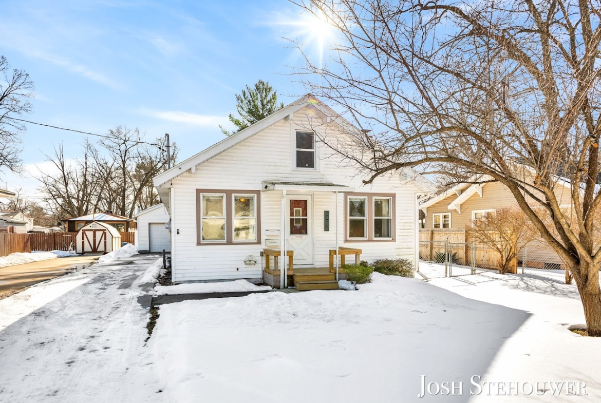 Snow-covered Holland, MI home exterior showing winter curb appeal.