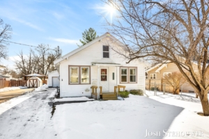 Snow-covered Holland, MI home exterior showing winter curb appeal.