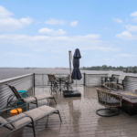 Lake-view deck overlooking water at a Holland, MI lakefront home in winter.