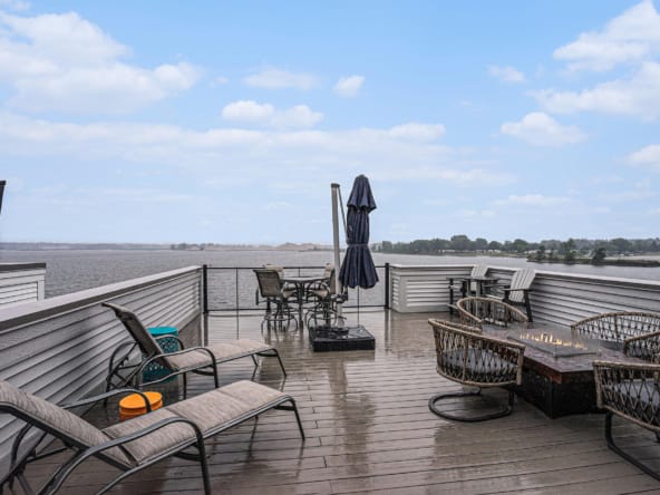 Lake-view deck overlooking water at a Holland, MI lakefront home in winter.