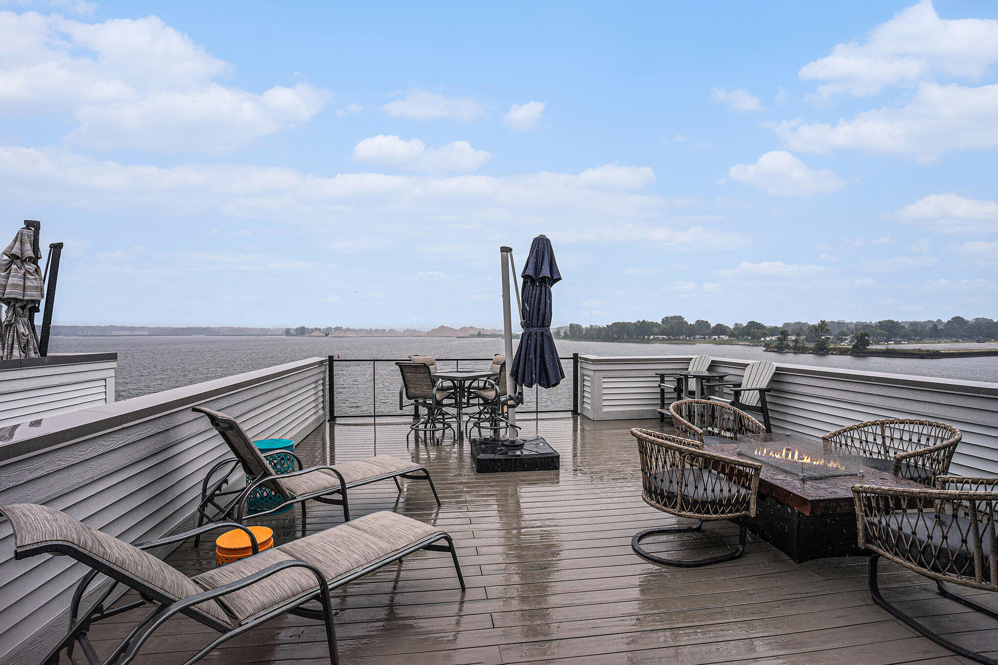 Lake-view deck overlooking water at a Holland, MI lakefront home in winter.