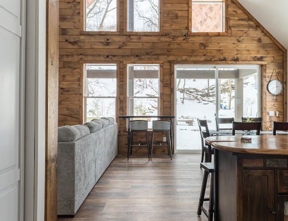 Modern open-concept living space with natural wood finishes in a West Michigan home