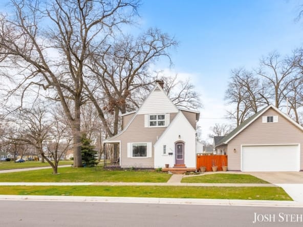 Charming single-family home in West Michigan neighborhood with trees and lawn