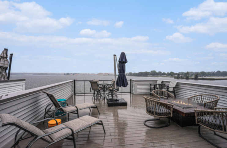 Lakeshore home deck with seating and lake views in West Michigan
