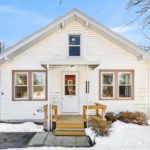 Front exterior of a West Michigan Lakeshore home with snow in winter