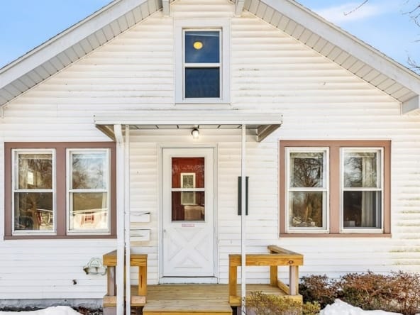 Front exterior of a West Michigan Lakeshore home with snow in winter