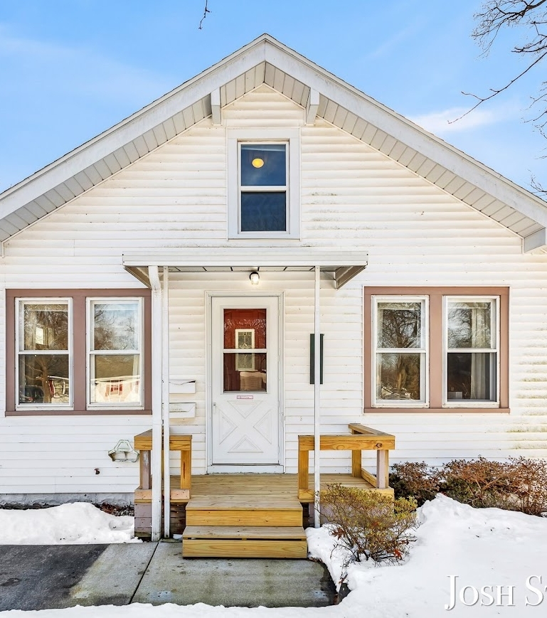 Front exterior of a West Michigan Lakeshore home with snow in winter