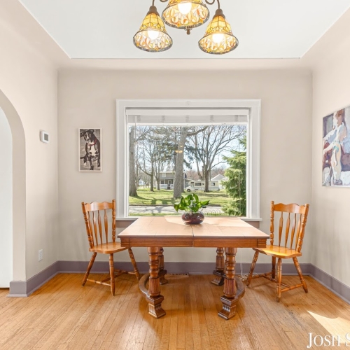 Dining room with large window and natural light inside a Holland, MI home.