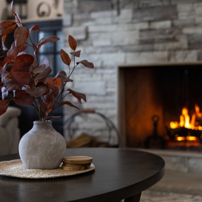 Living room of a cozy house with the fireplace on during the winter