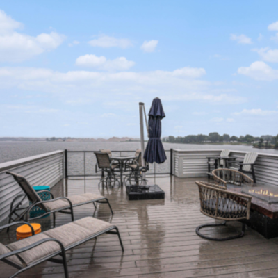 Lakeshore home deck with seating and lake views in West Michigan