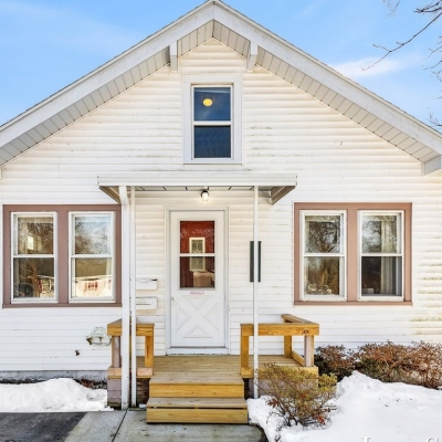 Front exterior of a West Michigan Lakeshore home with snow in winter