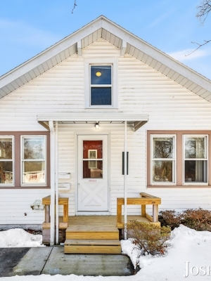 Front exterior of a West Michigan Lakeshore home with snow in winter